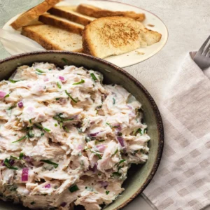 Creamy chicken salad with toasted bread served on a plate, chick-fil-a inspired homemade recipe